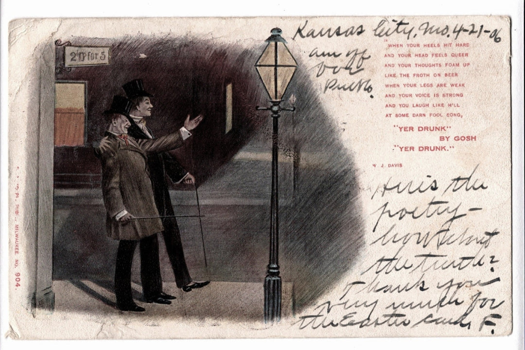 Vintage postcard with a man pointing at a streetlight, text on the back, and visible wear.