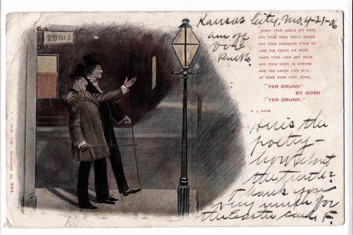 Vintage postcard with a man pointing at a streetlight, text on the back, and visible wear.