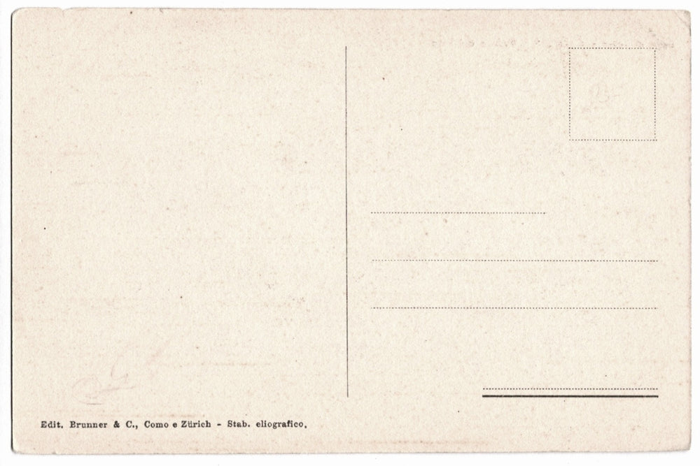 Back of a vintage postcard with printed text and lines for writing.