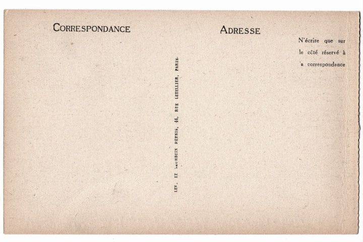 Back of a vintage buff postcard with printed text in French.