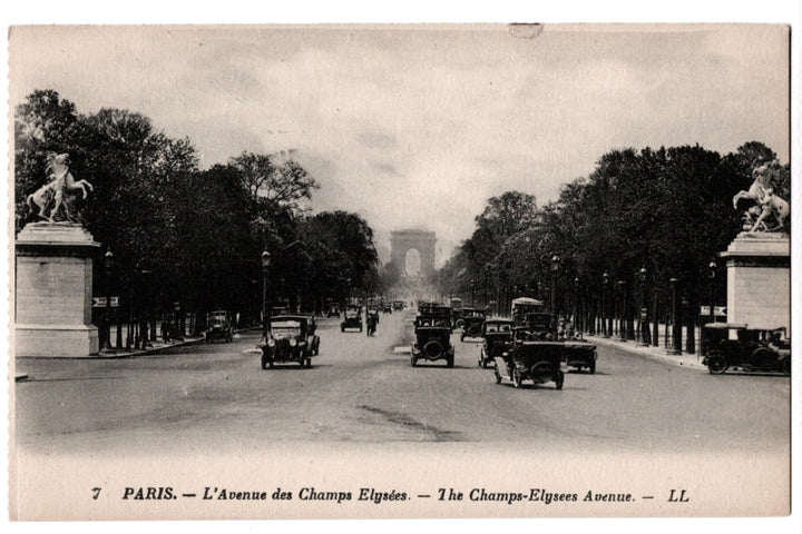 Vintage black and white postcard of the Champs-Elysees Avenue in Paris with cars and statues.