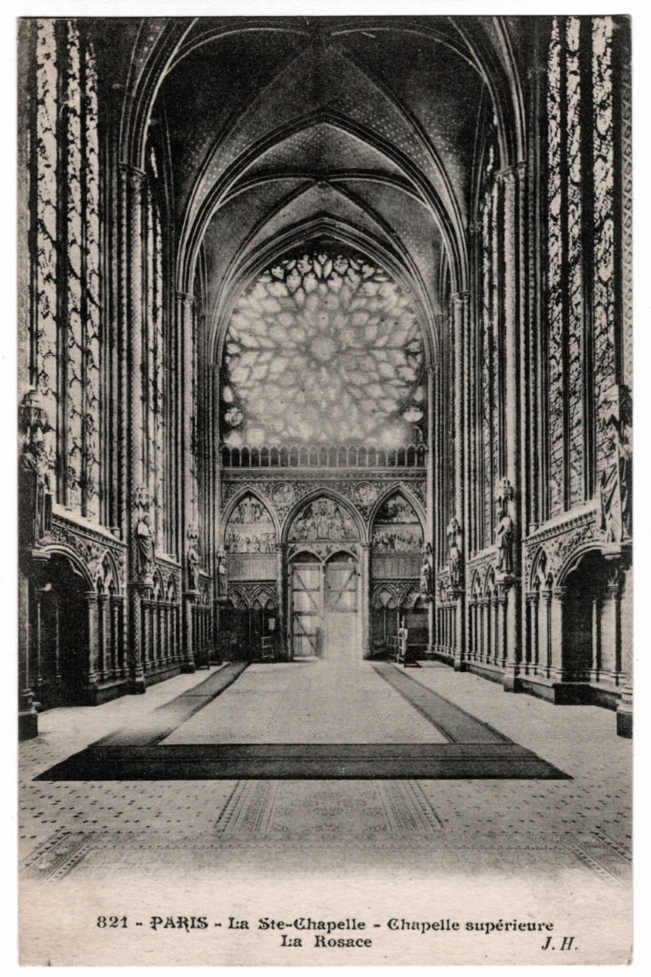 1910s Paris France Sainte-Chapelle Upper Chapel Rose Window Vintage Postcard. The perspective looks down the nave toward the western entrance, showing the intricate tile floor and the sculpted figures of the apostles along the pillars.