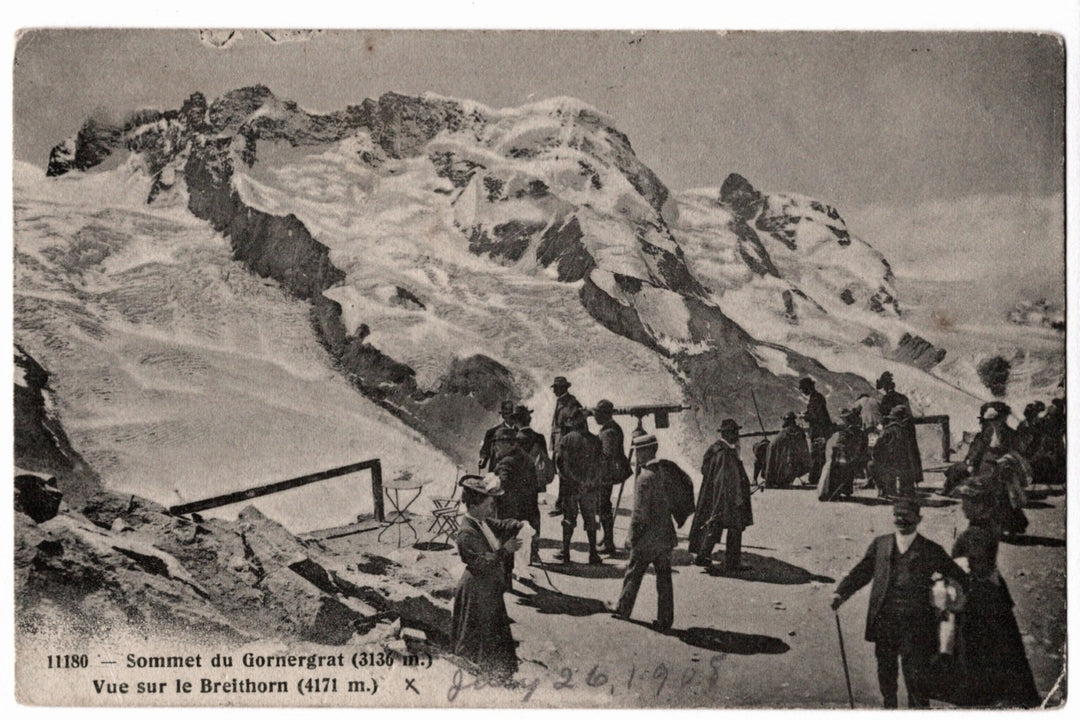 A panoramic view of the snow-covered Breithorn peak (4171 meters) in the Swiss Alps near Zermatt. A diverse group of early twentieth-century travelers in period attire, including men in bowler hats and women in long dresses, are seen congregating at the summit. One individual is looking through a mounted telescope.