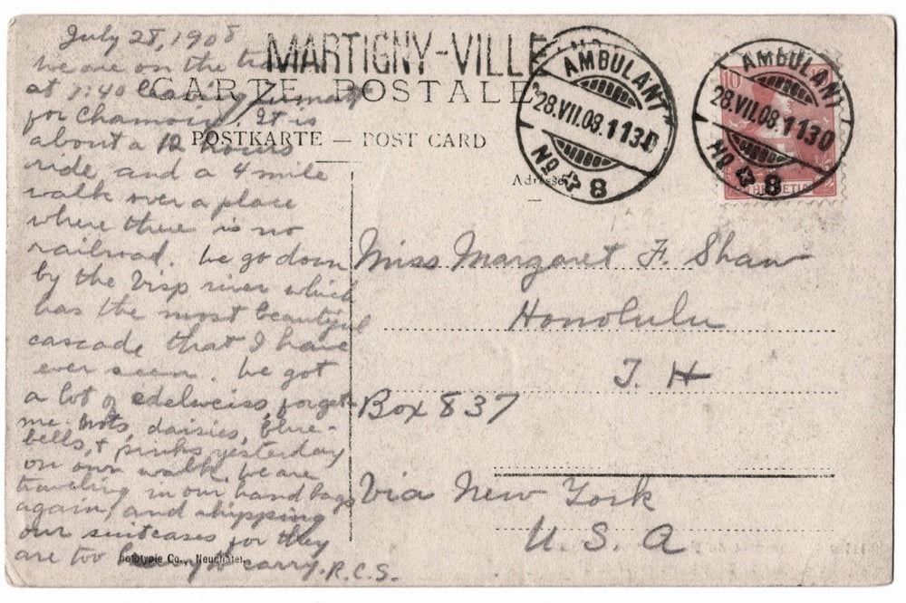 Vintage postcard with text and stamps, featuring a handwritten message.