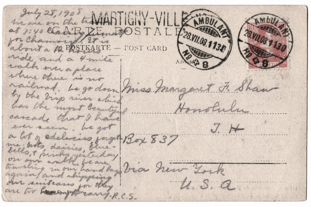 Vintage postcard with text and stamps, featuring a handwritten message.