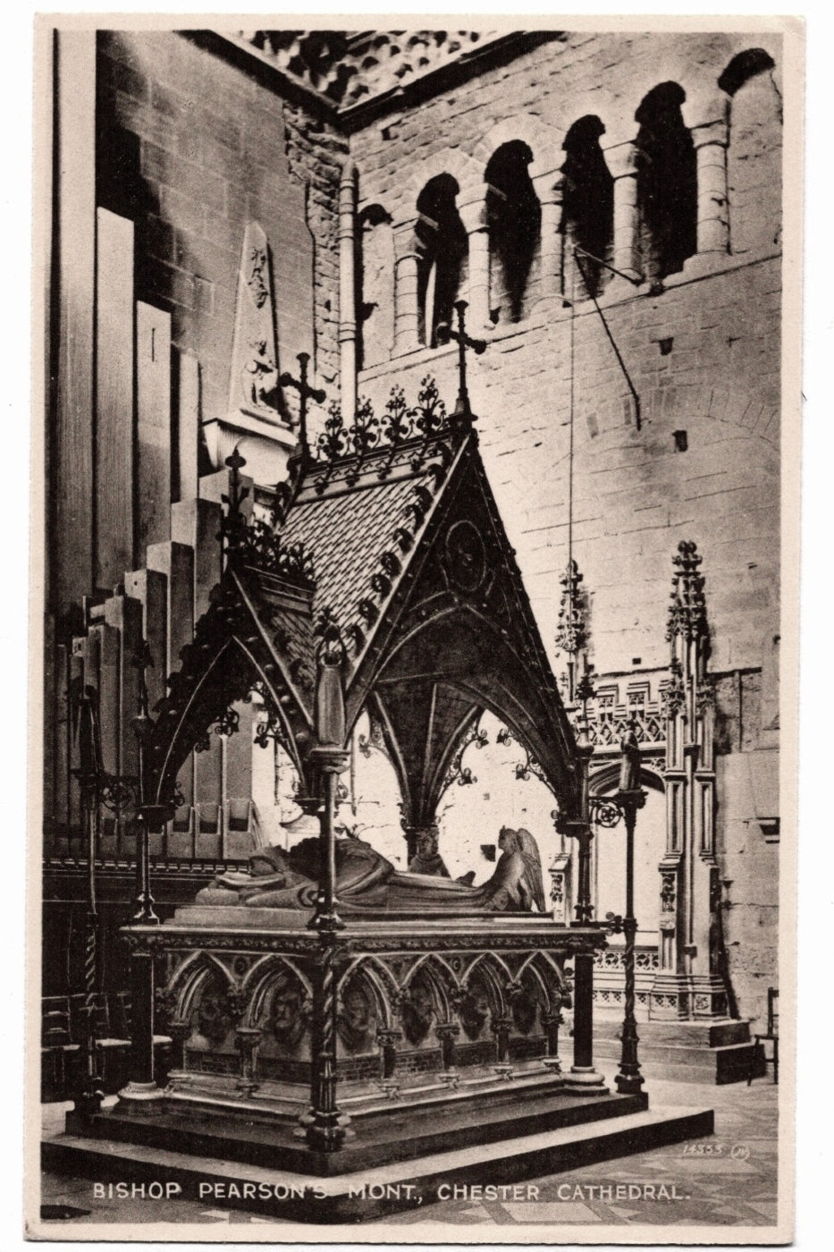 Vintage black and white photograph of a cathedral interior with a prominent tomb or statue.
