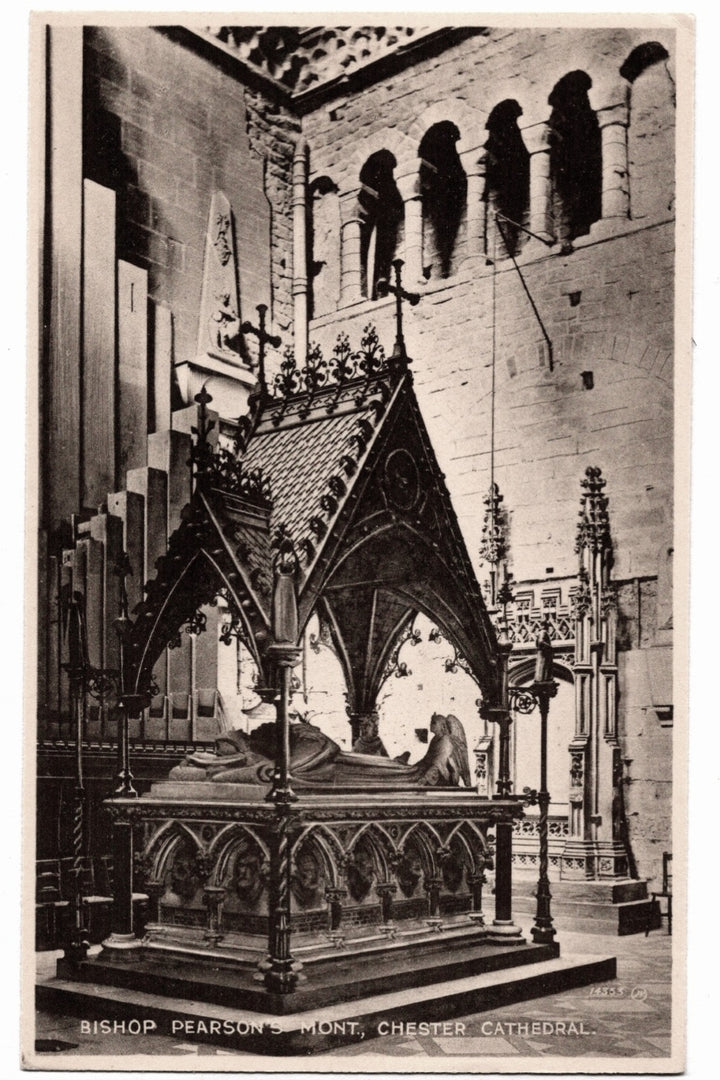 Vintage black and white photograph of a cathedral interior with a prominent tomb or statue.