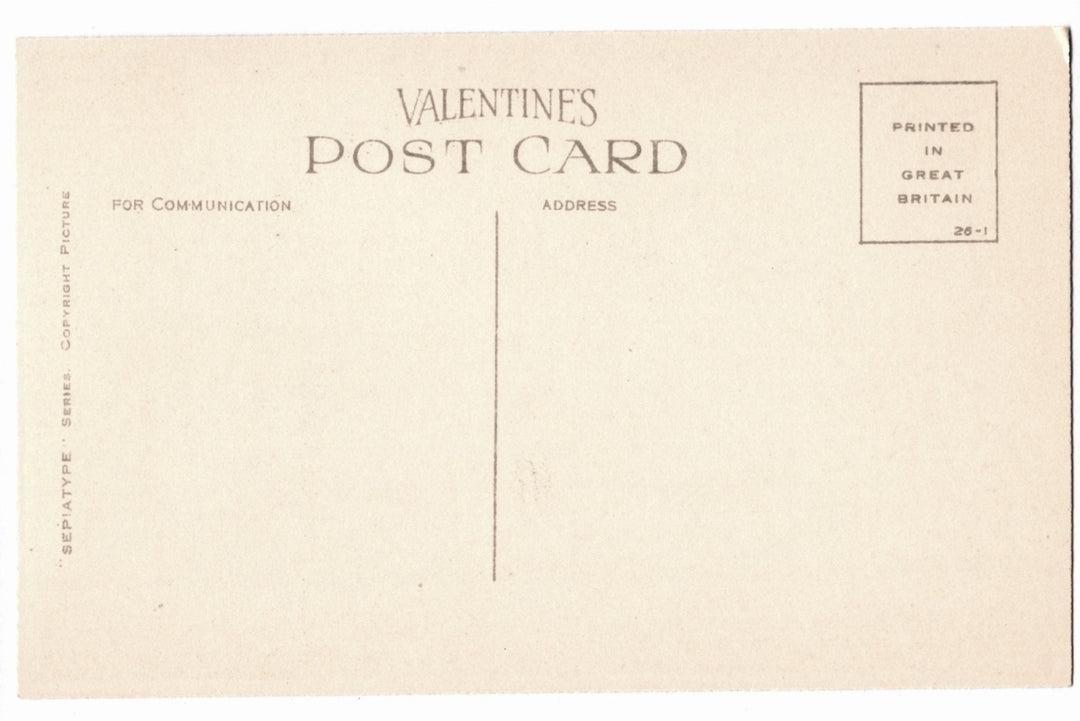 Back of postcard with text and a small square logo.