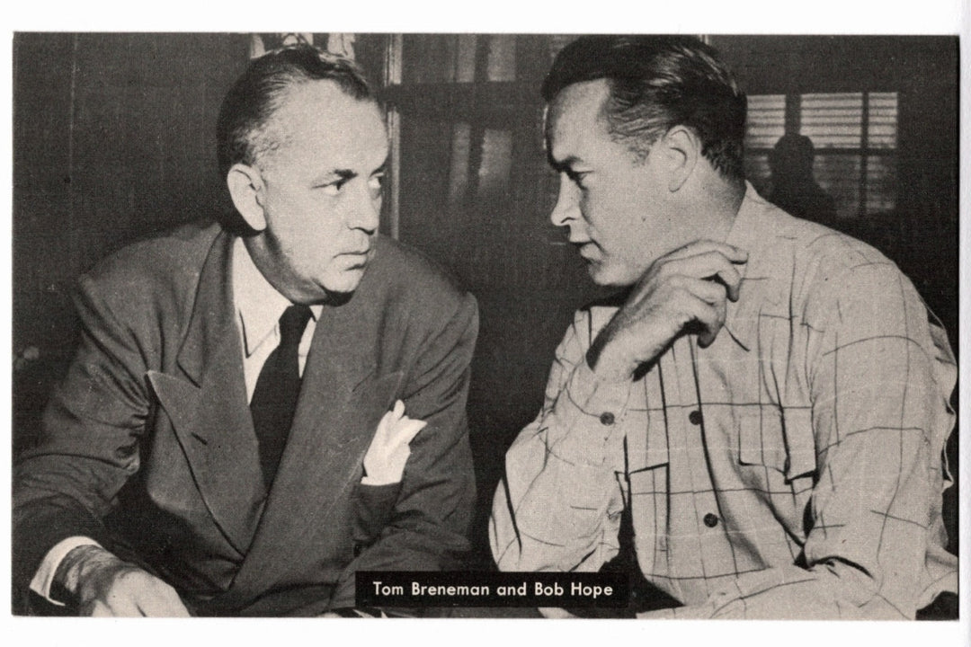 Two men, Tom Brennan and Bob Hope, sitting and talking in a black and white photo. 1945 Tom Breneman and Bob Hope Vintage Postcard.