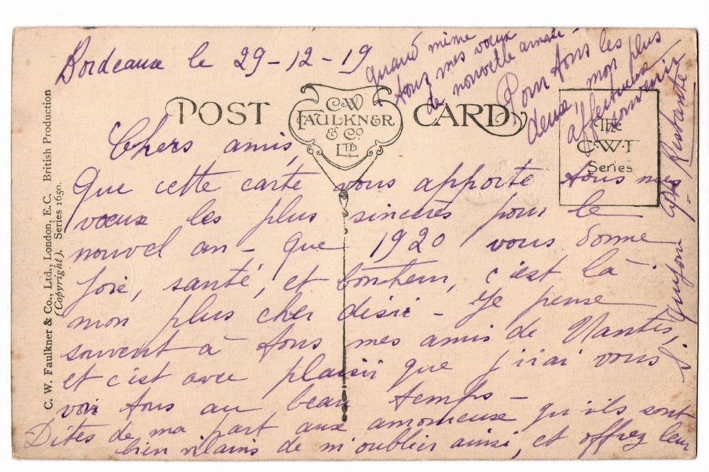 Back of a vintage postcard with text and address lines.