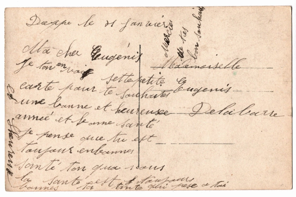 Back of a vintage postcard with text and address lines.