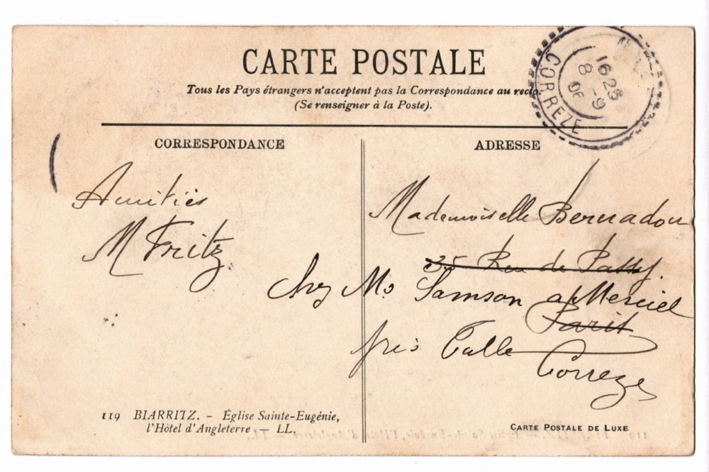 Back of a vintage postcard with text and address lines.