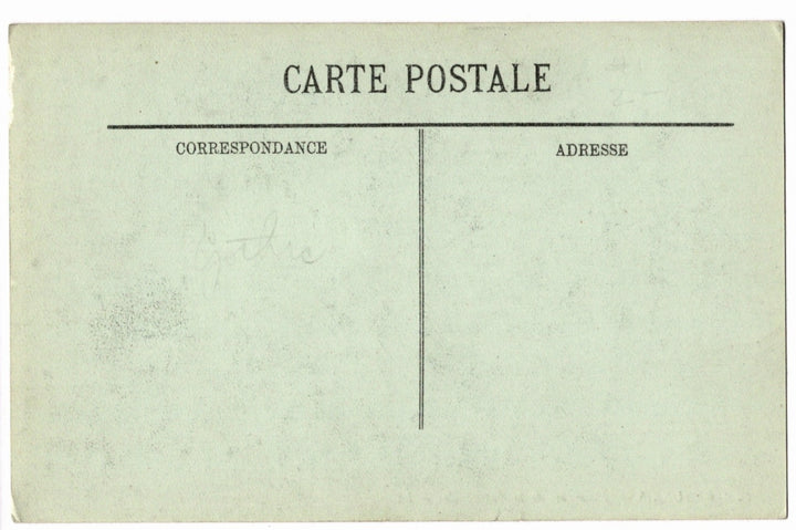 Back of a vintage postcard with text and address lines.