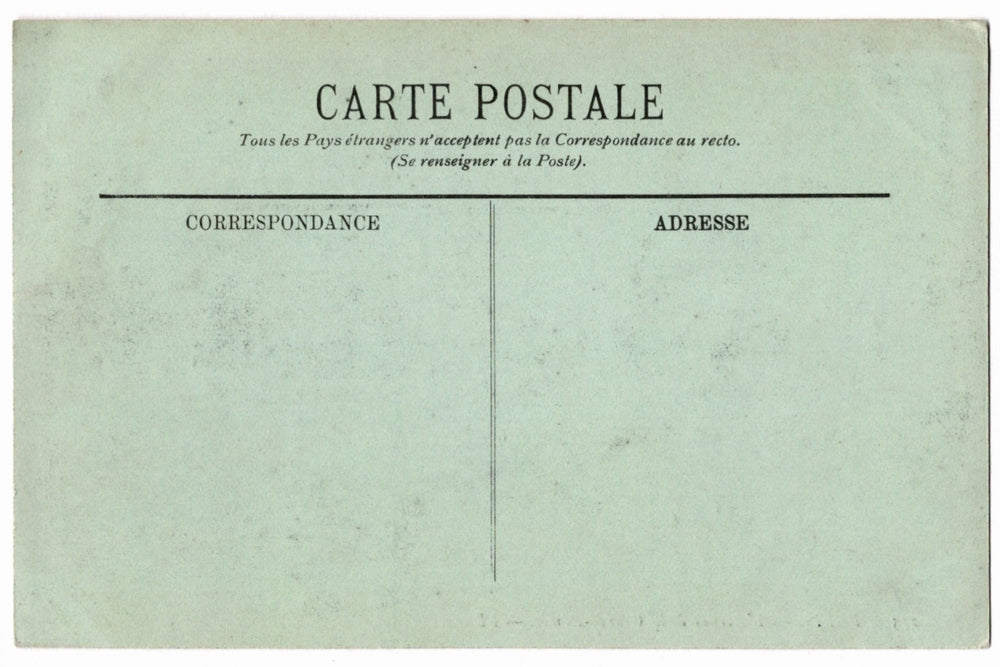 Back of a vintage postcard with text and address lines.