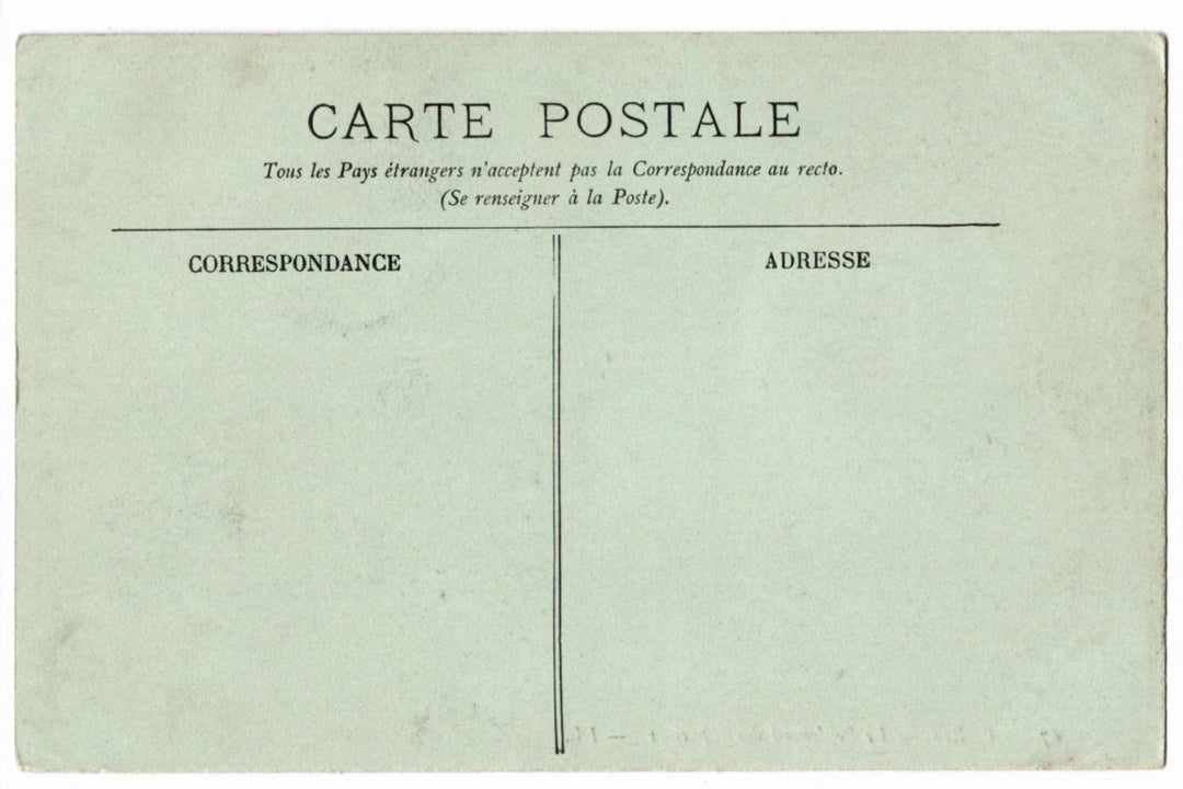 Back of a vintage postcard with text and address lines.