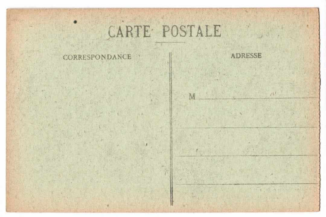 Back of a vintage postcard with text and address lines.