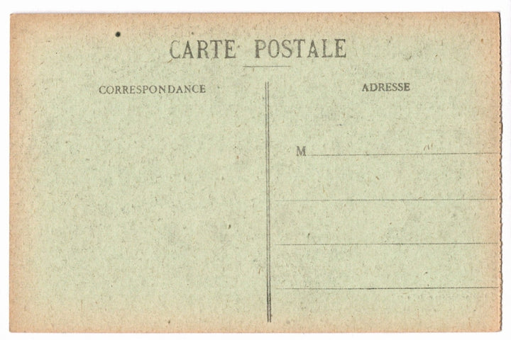 Back of a vintage postcard with text and address lines.