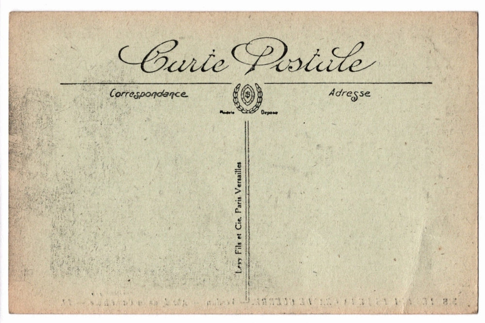 Back of a vintage postcard with text and address lines.