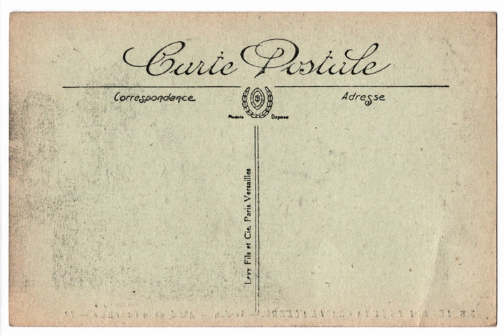 Back of a vintage postcard with text and address lines.