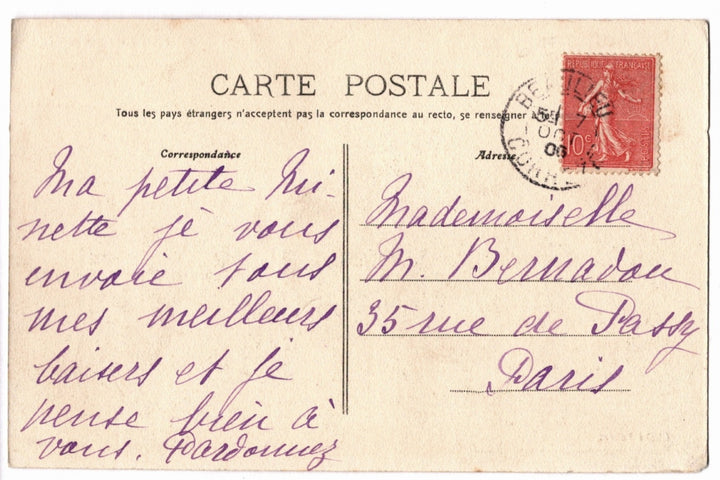 Vintage postcard with handwritten text and postage stamp.