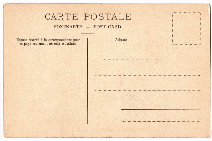 Back of a vintage postcard with text and address lines.