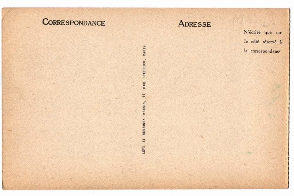 Back of a vintage postcard with text and address lines.