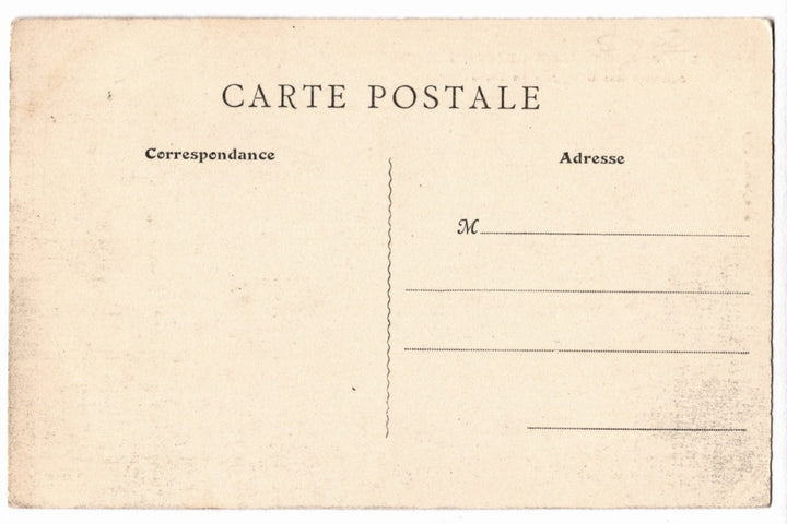 Back of a vintage postcard with text and address lines.