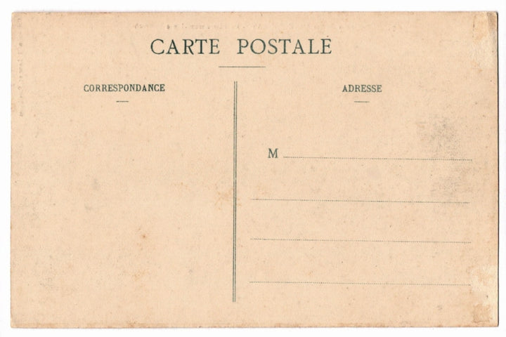 Back of a vintage postcard with text and address lines.