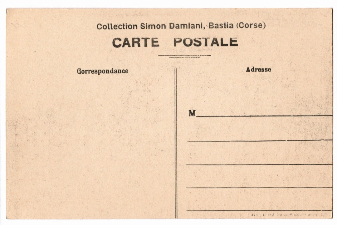 Back of a vintage postcard with text and address lines.