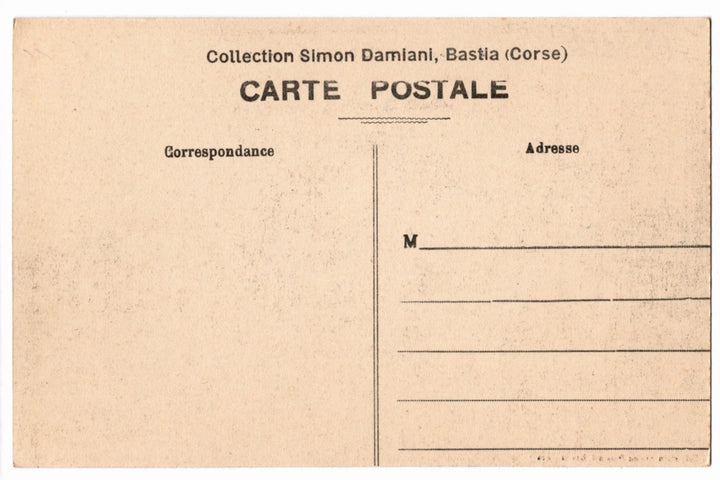Back of a vintage postcard with text and address lines.