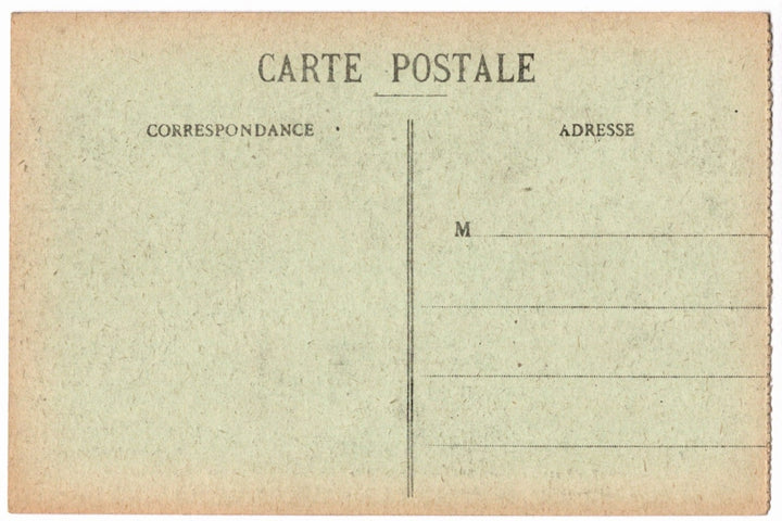 Back of a vintage postcard with text and address lines.