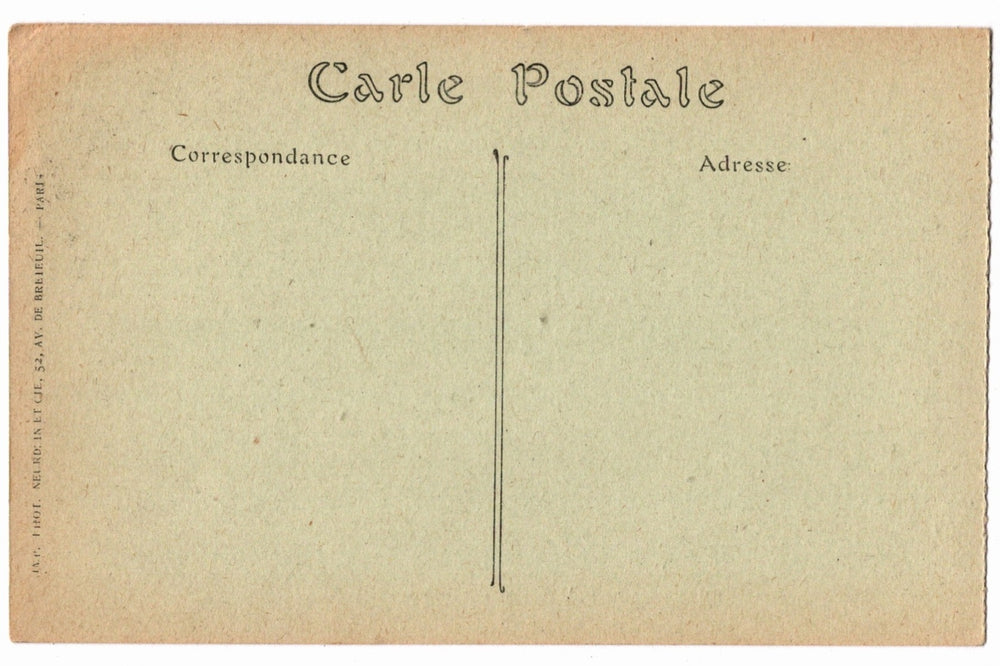 Back of a vintage postcard with text and address lines.