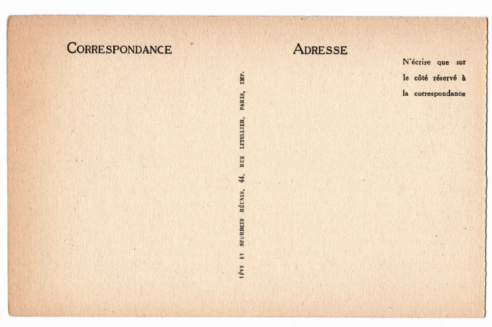 Back of a vintage postcard with text and address lines.