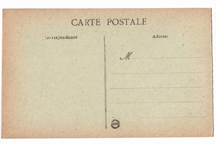 Back of a vintage postcard with text and address lines.