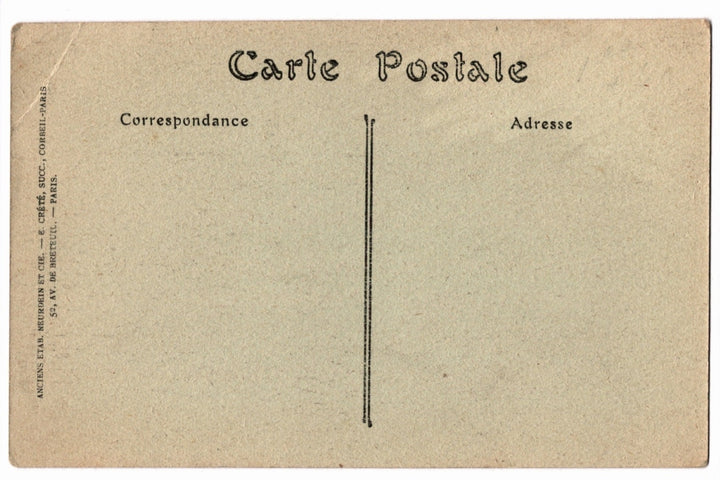 Back of a vintage postcard with text and address lines.