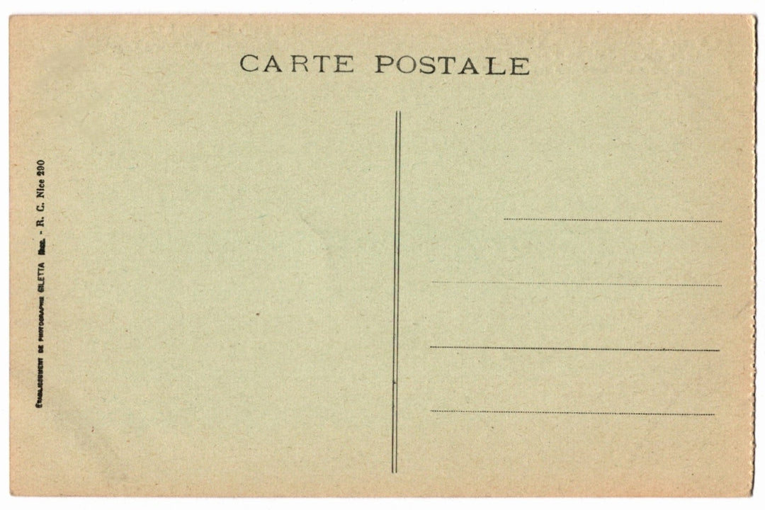 Back of a vintage postcard with text and address lines.