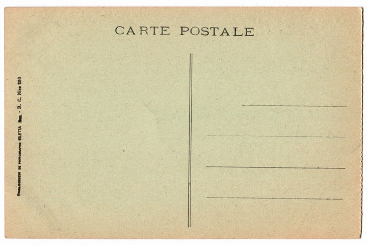 Back of a vintage postcard with text and address lines.