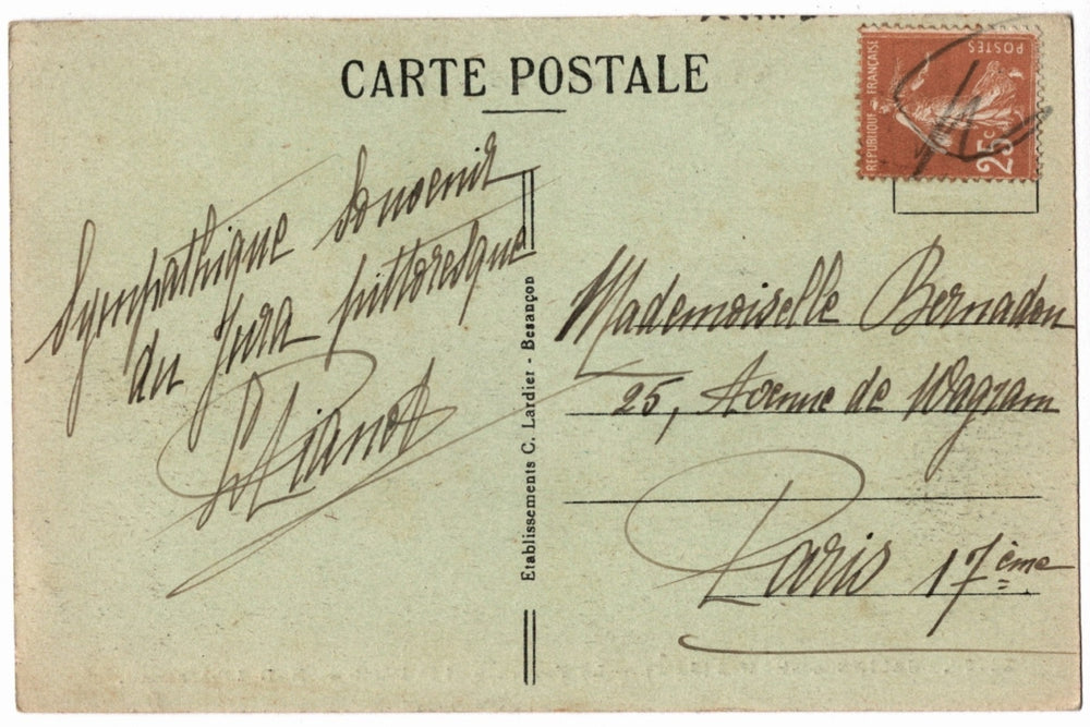 Back of a vintage postcard with text and address lines.