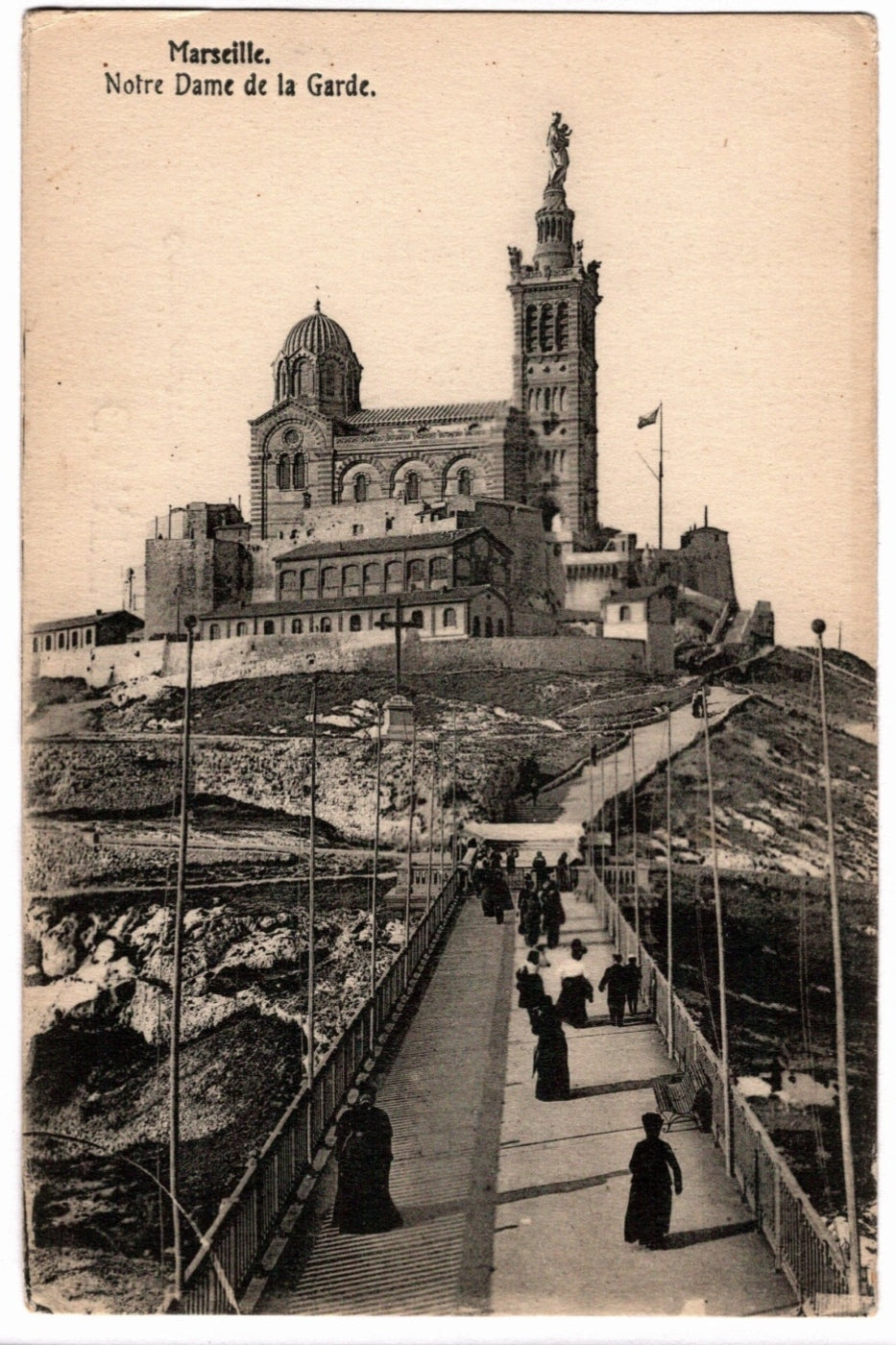 Vintage postcard of Notre-Dame de la Garde in Marseille, featuring a large cathedral and statue.