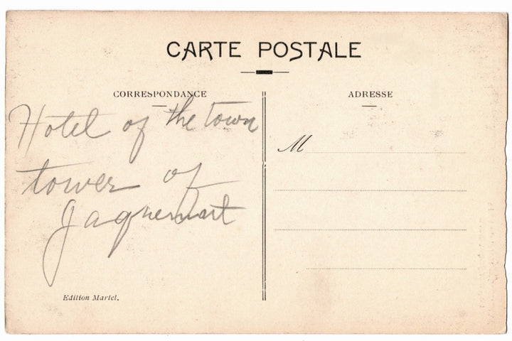 Vintage postcard with handwritten text on a beige background