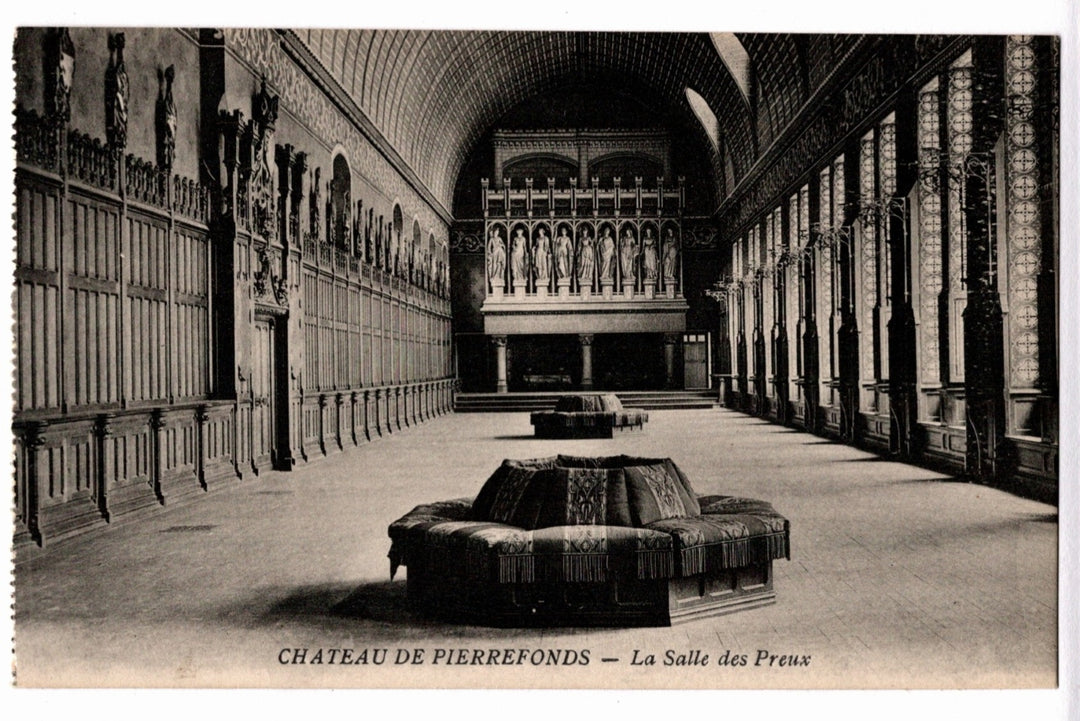 Interior of a grand hall with decorative walls and a fountain, labeled 'Chateau de Pierrefonds - La Salle des Preus'.  1906 Hall of the Worthy Ladies Pierrefonds France Vintage Postcard.