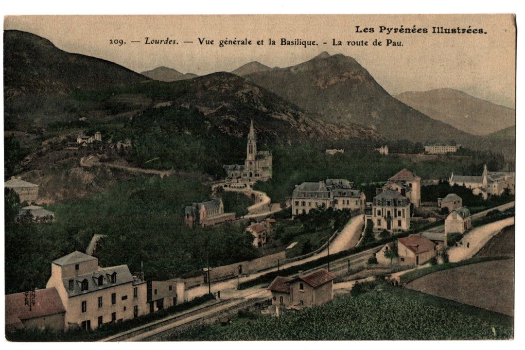 Vintage postcard of Lourdes with mountains and basilica, labeled 'Les Pyrénées Illustrées'.
