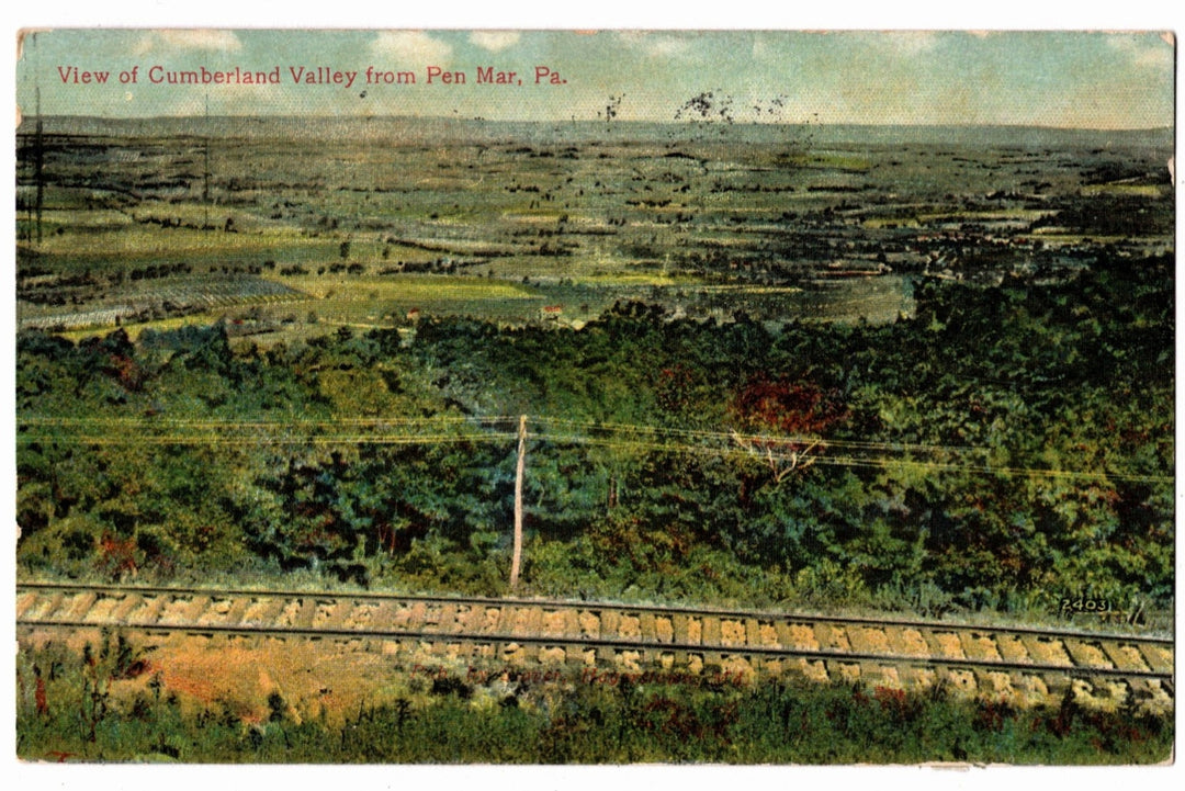 Vintage postcard of a view of the Cumberland Valley from Pen Mar, PA with train tracks in the foreground.