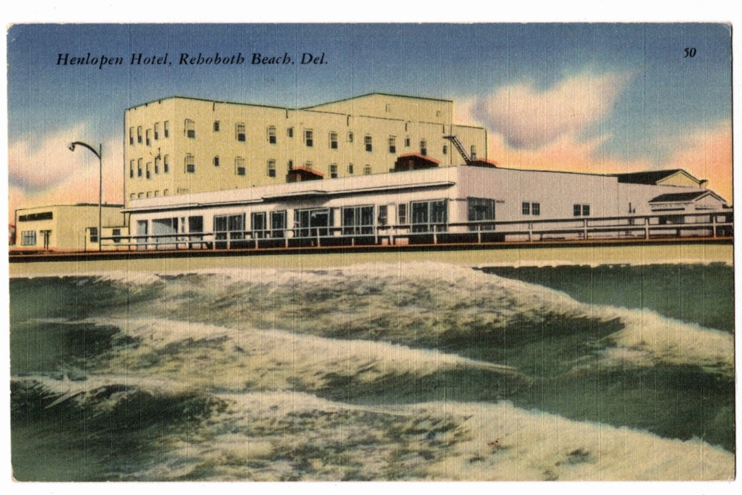 Vintage postcard of Henlopen Hotel at Rehoboth Beach, Delaware with ocean waves in the foreground.