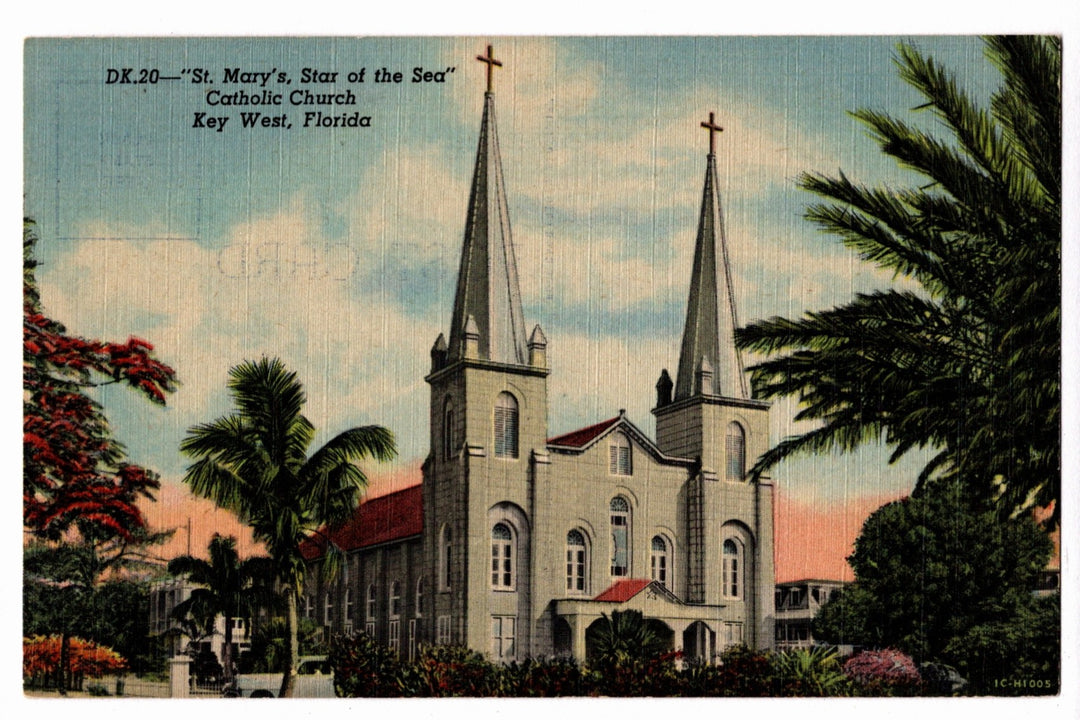 St. Mary's Star of the Sea Catholic Church in Key West, Florida, with palm trees and a clear sky.