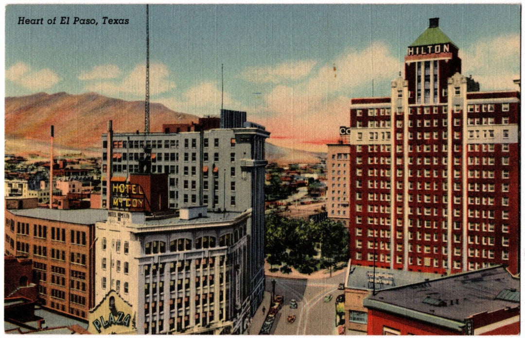 Vintage postcard of El Paso, Texas with buildings and mountains in the background