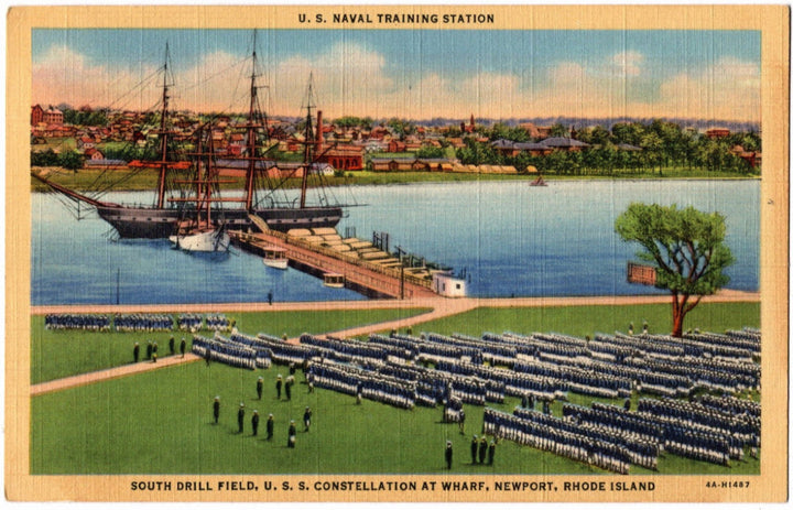 Vintage postcard of U.S. Naval Training Station with ships and drill field at Wharf, Newport, Rhode Island.