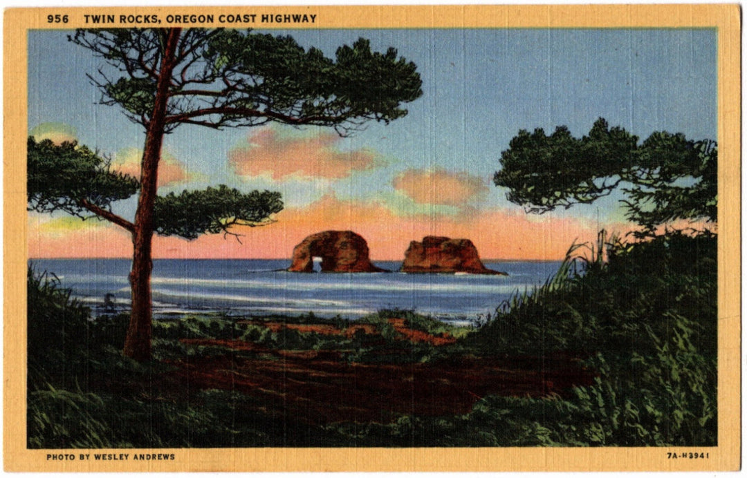 Vintage postcard of Twin Rocks on the Oregon Coast Highway with trees and a sunset.