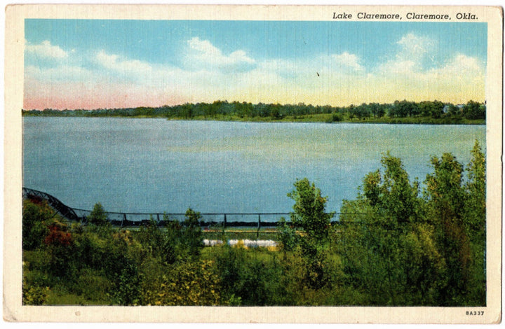 Vintage postcard of Lake Claremore, Claremore, Oklahoma with a scenic view of the lake and surrounding trees.