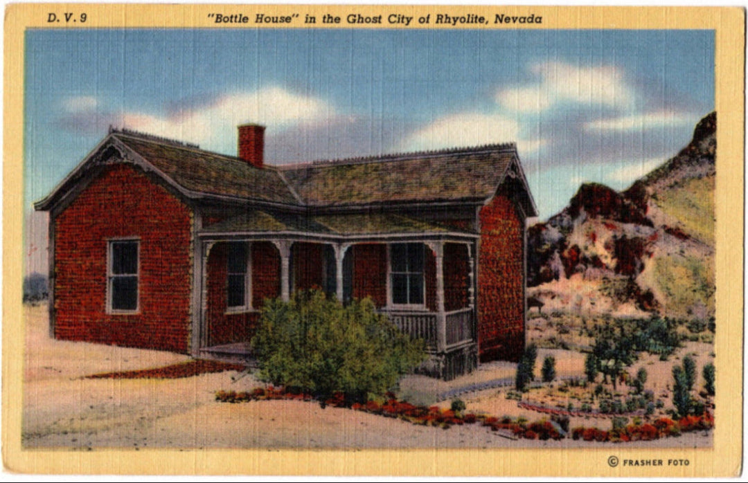 Vintage postcard of a red brick house labeled 'Bottle House' in Rhyolite, Nevada.